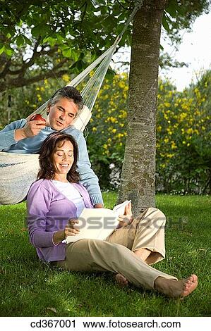 baby boomer, calm, book, barefoot, apple View Large Photo Image Stock Image - baby boomer, calm, book, barefoot, apple. Fotosearch