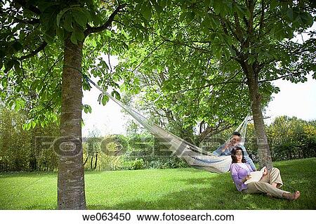 Stock Image - baby boomer, calm, book, barefoot, apple. Fotosearch