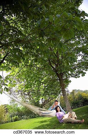 Stock Photography - baby boomer, calm, book, barefoot, apple. Fotosearch