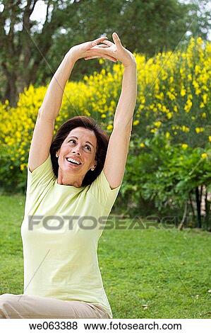 Stock Photo - baby boomer, carefree, Arms raised. Fotosearch