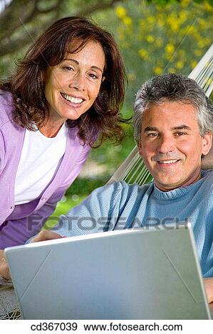 Stock Photo - baby boomer, computer, contemporary. Fotosearch