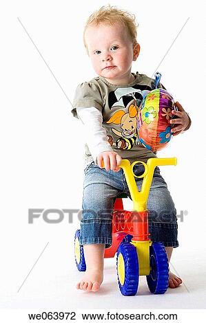 Stock Image - baby, boy, barefoot, balloon, 3-4 years. Fotosearch