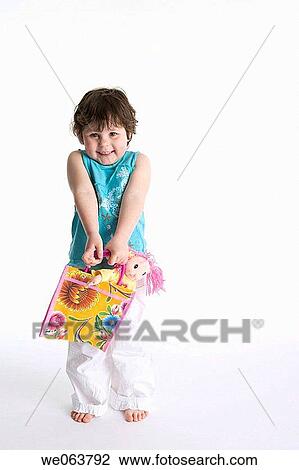 Stock Image - baby, brunette, barefoot, bag, 3-4 years. Fotosearch
