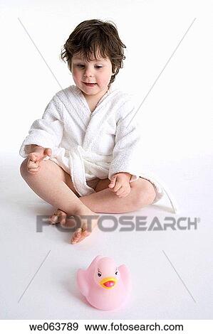 Stock Photo - baby, brunette, bathrobe, barefoot, 3-4 years. Fotosearch