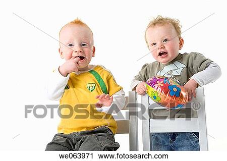Stock Image - baby, chair, boy, balloon, 3-4 years. Fotosearch