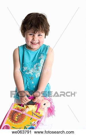 Stock Image - baby, child, brunette, bag, 3-4 years. Fotosearch
