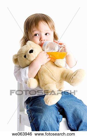 Stock Photograph - baby, child, chair, Baby bottle, 3-4 years. Fotosearch