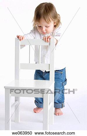 Stock Image - baby, child, chair, barefoot, 3-4 years. Fotosearch