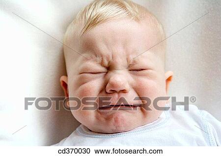 Stock Image - baby, Close-up, child, blond, angry. Fotosearch