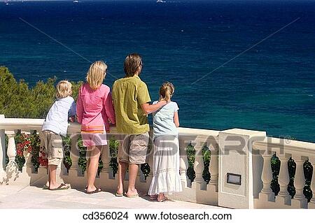 back view, balcony, boy, brother View Large Photo Image Picture - back view, balcony, boy, brother. Fotosearch
