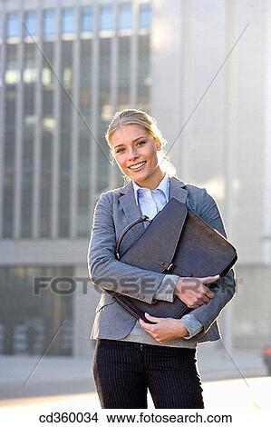 backlight, blond, blue eyes, briefcase, business View Large Photo Image Picture - backlight, blond, blue eyes, briefcase, business. Fotosearch