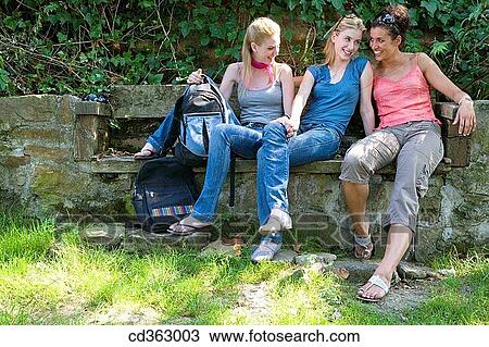 Stock Image - backpack, break-time, break, bench, amusement. Fotosearch