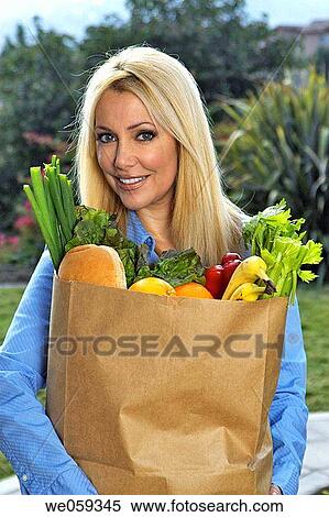 Stock Photography - bag, blond, blue eyes, carry, carrying. Fotosearch