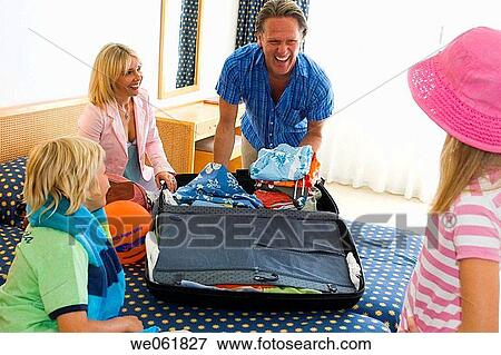 Stock Photo - baggage, boy, bed, accommodation. Fotosearch