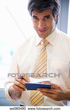 Ball-point pen, black hair, business, businessman, businesspeople View Large Photo Image Stock Image - Ball-point pen, black hair, business, businessman, businesspeople. Fotosearch