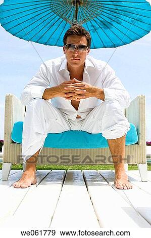 barefoot, blue, black hair, armchair View Large Photo Image Stock Photo - barefoot, blue, black hair, armchair. Fotosearch