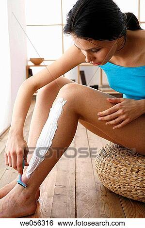 Stock Photograph - barefoot, Body care, brunette, contemporary. Fotosearch
