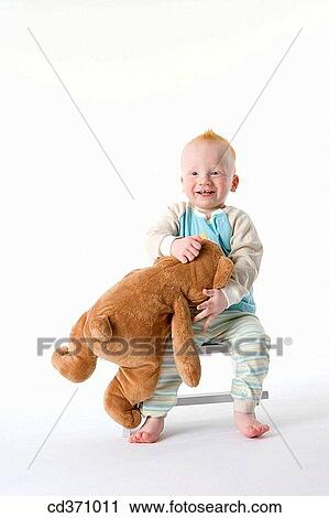 Stock Image - barefoot, chair, boy, big, 3-4 years. Fotosearch