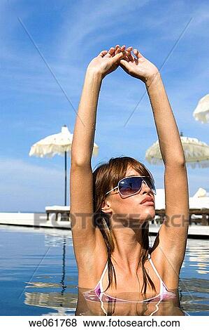 Stock Photo - bathe, brunette, bathing, Arms raised. Fotosearch