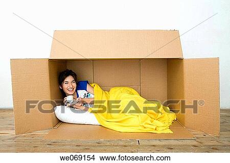 bed, blanket, brunette, cardboard View Large Photo Image Picture - bed, blanket, brunette, cardboard. Fotosearch