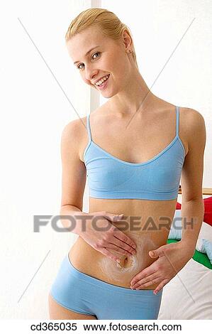 belly, Body care, blond, apply View Large Photo Image Stock Photography - belly, Body care, blond, apply. Fotosearch