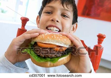 big, black hair, boy, burger, calorie View Large Photo Image Stock Image - big, black hair, boy, burger, calorie. Fotosearch