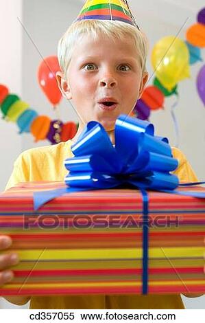 Stock Photography - Birthday party, blond, bow, boy, cap. Fotosearch