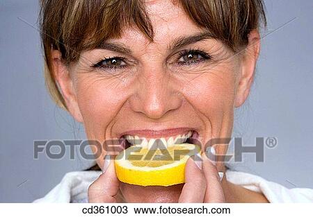 bite, Citrus fruit, biting, acid View Large Photo Image Stock Image - bite, Citrus fruit, biting, acid. Fotosearch