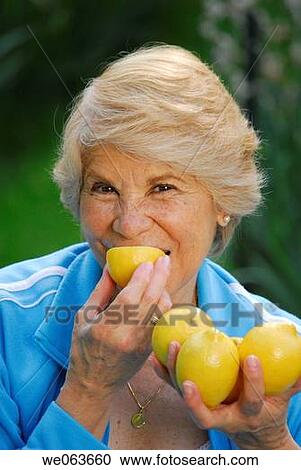 bite, Citrus fruit, biting, acid View Large Photo Image Stock Image - bite, Citrus fruit, biting, acid. Fotosearch