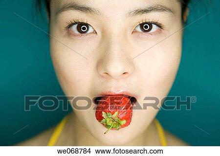 bite, Close-up, biting, Asian View Large Photo Image Picture - bite, Close-up, biting, Asian. Fotosearch