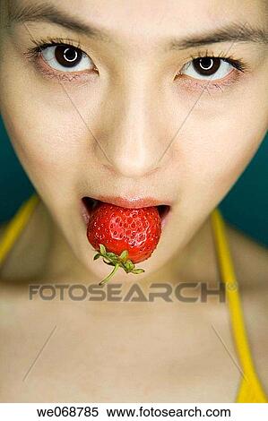 bite, Close-up, biting, Asian View Large Photo Image Stock Photography - bite, Close-up, biting, Asian. Fotosearch