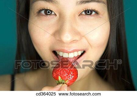 bite, Close-up, Chinese, biting, Asian View Large Photo Image Stock Photography - bite, Close-up, Chinese, biting, Asian. Fotosearch