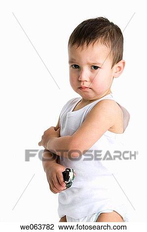 Stock Image - black hair, angry, Bad mood, baby, automobile, 3-4 years. Fotosearch
