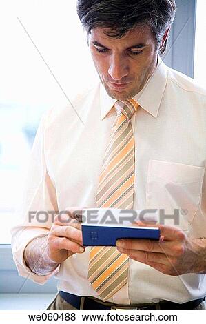 Stock Photo - black hair, business, businessman, businesspeople. Fotosearch