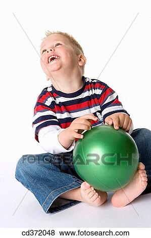 Stock Photo - blond, amusement, barefoot, ball, baby, 3-4 years. Fotosearch