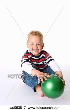 Stock Photo - blond, amusement, barefoot, ball, baby, 3-4 years. Fotosearch