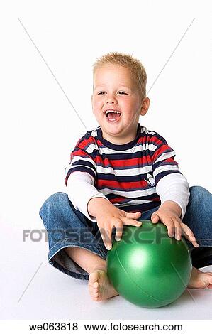 Stock Photo - blond, amusement, barefoot, ball, baby, 3-4 years. Fotosearch