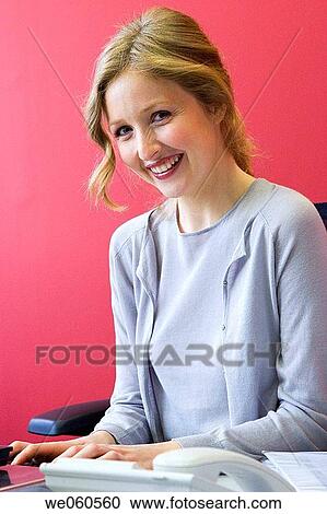 Stock Image - blond, blue eyes, business, businesspeople, businesswoman. Fotosearch