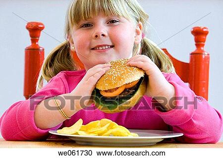 Stock Image - blond, burger, calorie, child, childhood. Fotosearch
