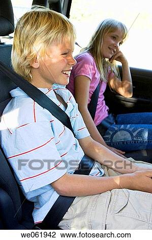 Stock Image - blond, car, brother, boy, automobile. Fotosearch