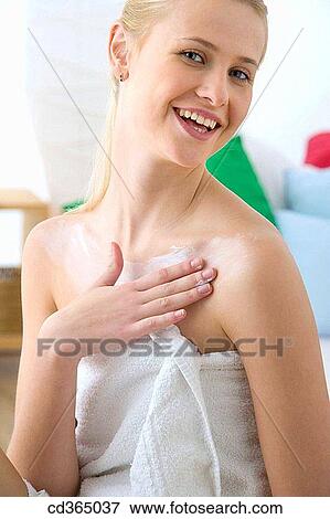 Stock Photo - blond, carnality, Body care, apply. Fotosearch