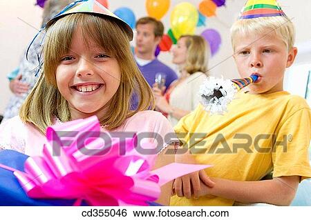 blow, blowing, bow, boy, brother, cap View Large Photo Image Stock Photograph - blow, blowing, bow, boy, brother, cap. Fotosearch