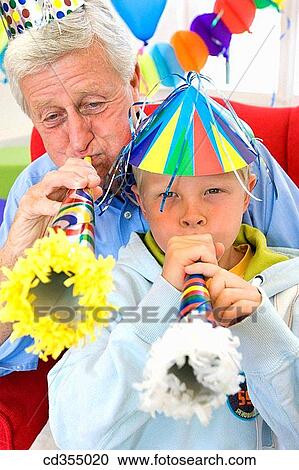 blow, cap, boy, blowing, amusement View Large Photo Image Stock Image - blow, cap, boy, blowing, amusement. Fotosearch