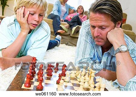 Stock Image - board, brother, boy, at-home. Fotosearch
