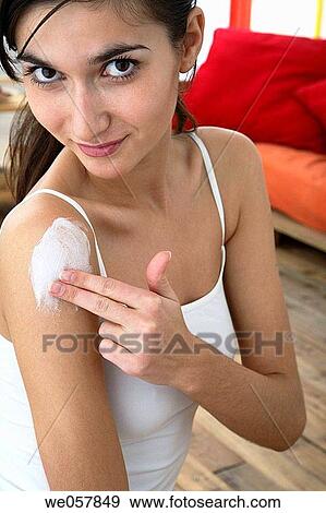 Body care, carnality, brunette, apply View Large Photo Image Stock Photo - Body care, carnality, brunette, apply. Fotosearch