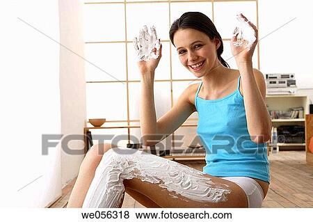 Stock Photo - Body care, contemporary, brunette, apply. Fotosearch