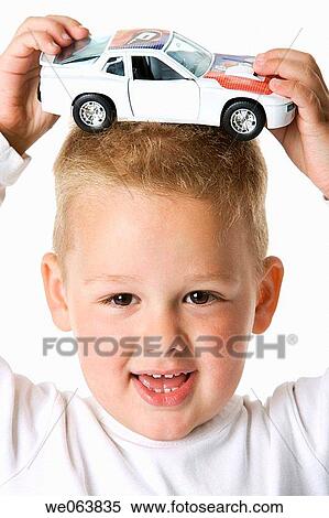 Stock Photography - boy, amusement, blond, baby, automobile, 3-4 years. Fotosearch