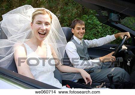 Bridal couple in a convertible. Gipuzkoa, Euskadi. View Large Photo Image Picture - Bridal couple in a convertible. Gipuzkoa, Euskadi.. Fotosearch