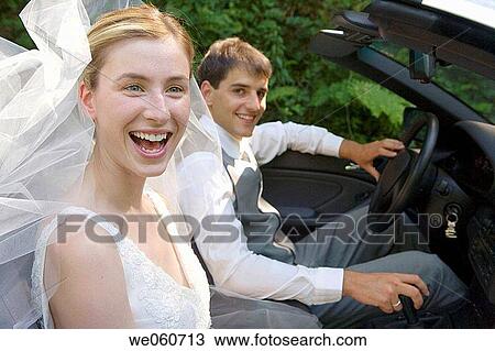 Stock Image - Bridal couple in a convertible. Gipuzkoa, Euskadi.. Fotosearch