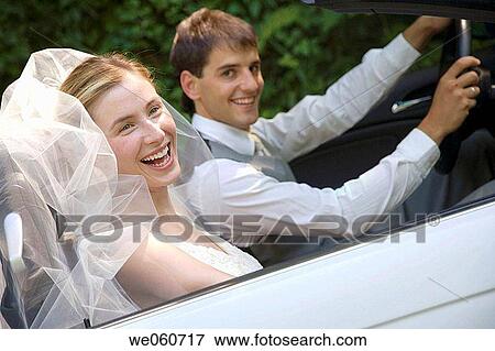 Bridal couple in a convertible. Gipuzkoa, Euskadi. View Large Photo Image Stock Photo - Bridal couple in a convertible. Gipuzkoa, Euskadi.. Fotosearch